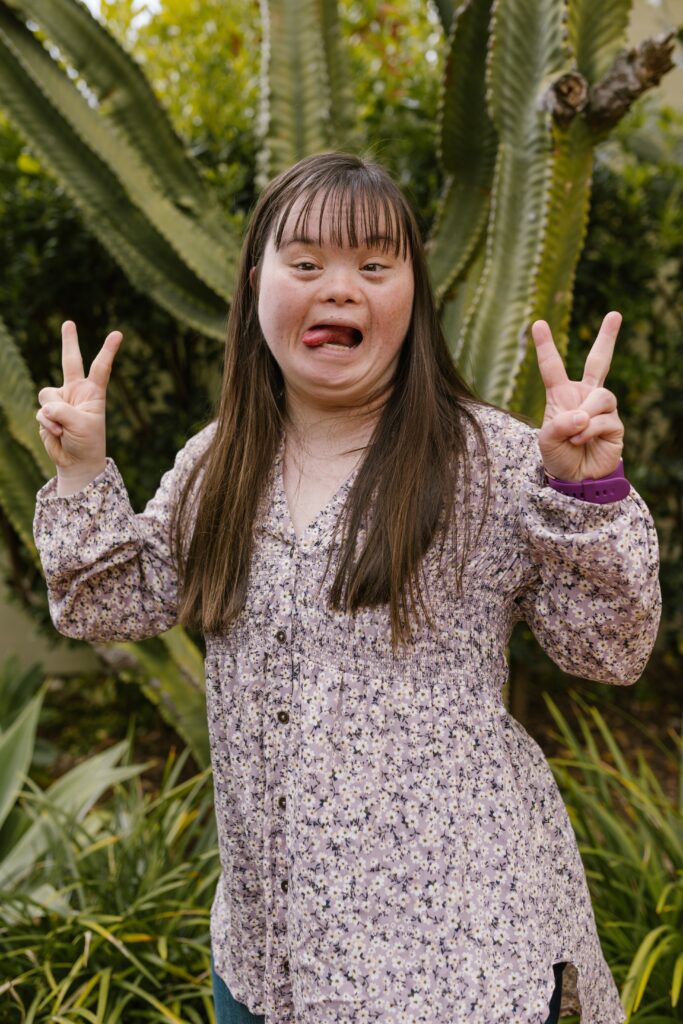 a down syndrome girl having the time of her life showing why person centred care is so important.